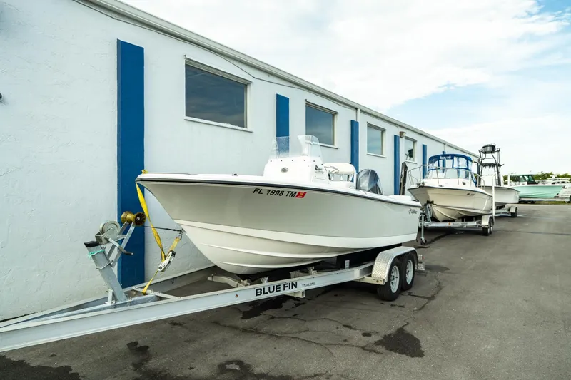 Slide: The Image of 2023 Edgewater 188CC boat on trailer outside building. - 4