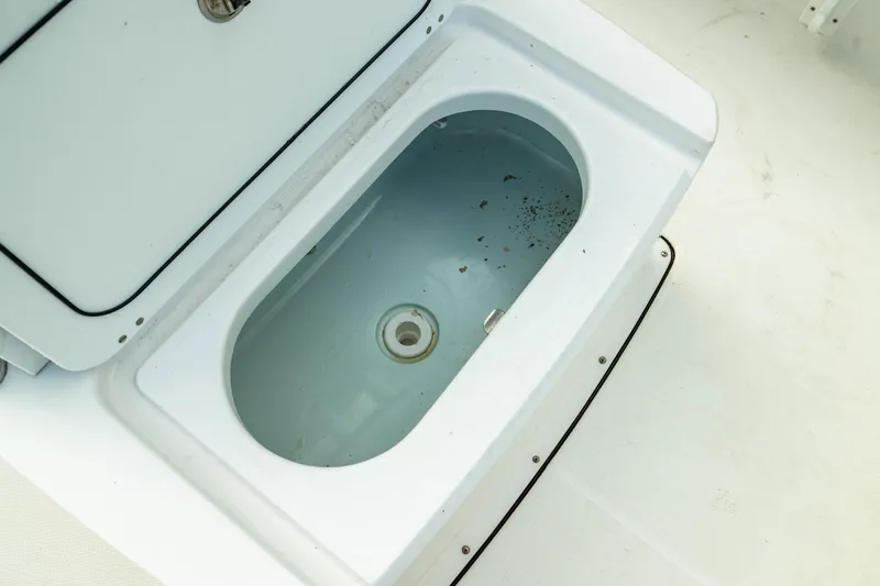 Slide: The Image of Livewell compartment on 2023 Edgewater 188CC boat, open and empty. - 5