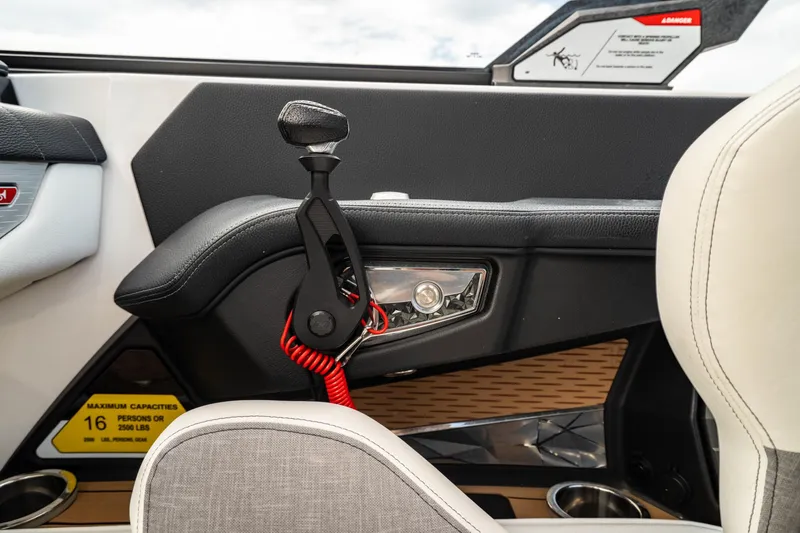 Slide: The Image of Interior of 2022 Nautique Super Air Nautique G23 boat, featuring sleek design and controls. - 13
