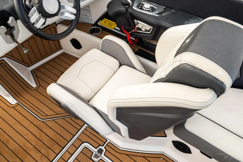 Slide: The Image of 2022 Nautique Super Air Nautique G23 interior with luxury seating and sleek design. - 15