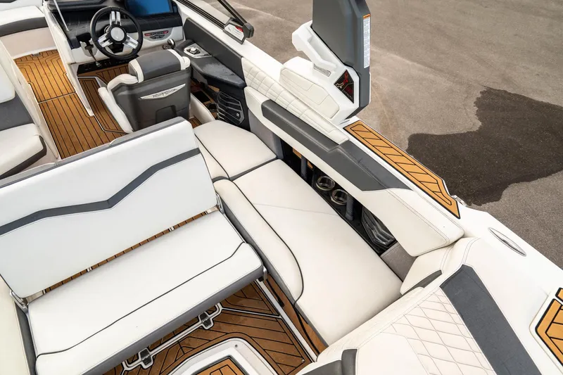 Slide: The Image of Luxurious interior of 2022 Nautique Super Air Nautique G23 boat with premium seating. - 19
