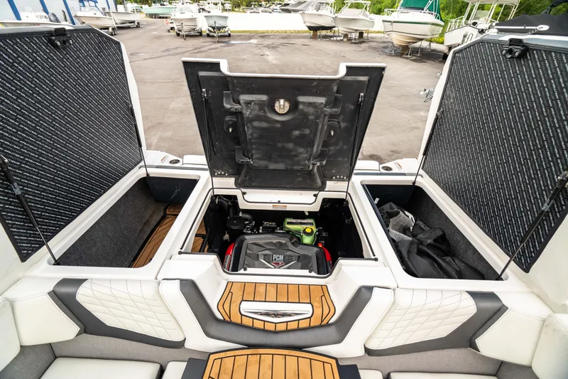 Slide: The Image of 2022 Nautique Super Air Nautique G23 engine compartment with open hatches. - 27