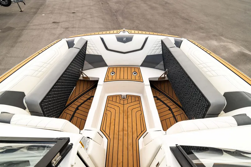 Slide: The Image of 2022 Nautique Super Air Nautique G23 boat interior with stylish seating and teak flooring. - 32