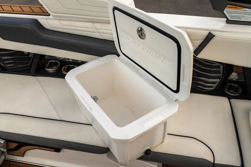 Slide: The Image of Open storage compartment in 2022 Nautique Super Air Nautique G23 boat interior. - 33