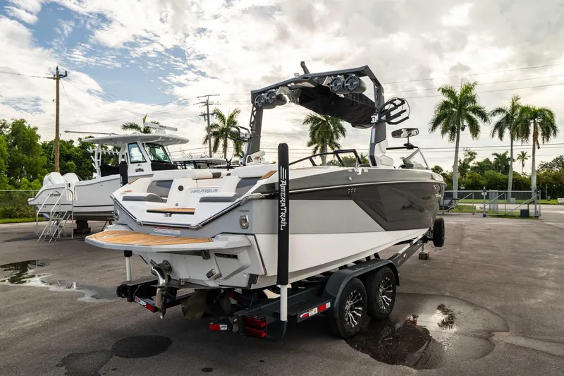 Slide: The Image of 2022 Nautique Super Air Nautique G23 boat on trailer, parked outdoors. - 41