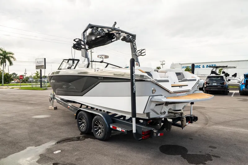Slide: The Image of 2022 Nautique Super Air Nautique G23 boat on trailer in parking lot. - 43