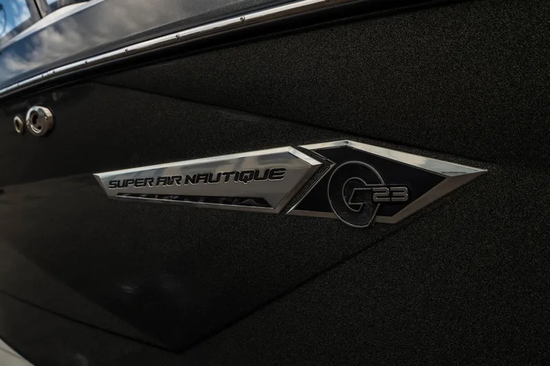 Slide: The Image of 2022 Nautique Super Air Nautique G23 logo on sleek black exterior. - 47