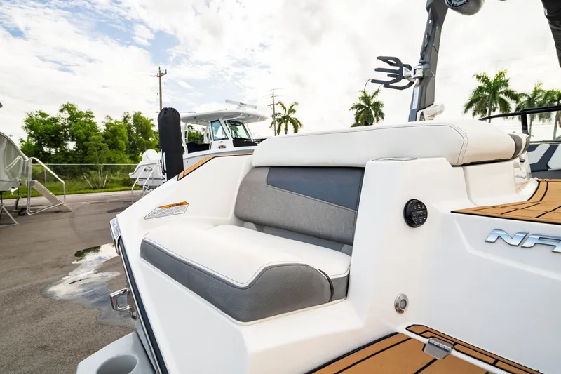 Slide: The Image of 2022 Nautique Super Air Nautique G23 boat with sleek seating and modern design. - 8