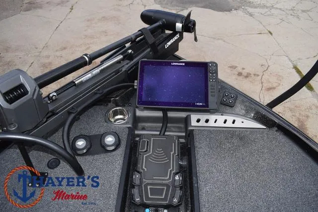 Slide: The Image of 2020 Triton 20 TRX Patriot boat dashboard with Lowrance electronics and Thayer's Marine logo. - 13