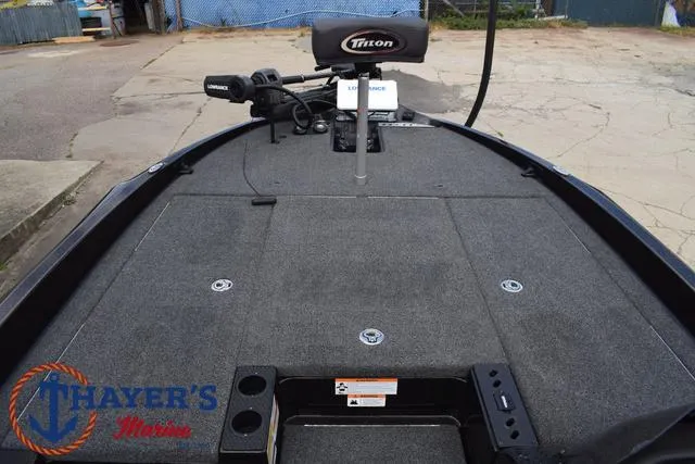 Slide: The Image of 2020 Triton 20 TRX Patriot boat deck with Thayer's Marine logo. - 16