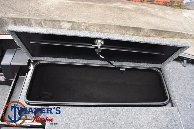 Slide: The Image of Open storage compartment in 2020 Triton 20 TRX Patriot boat. - 17