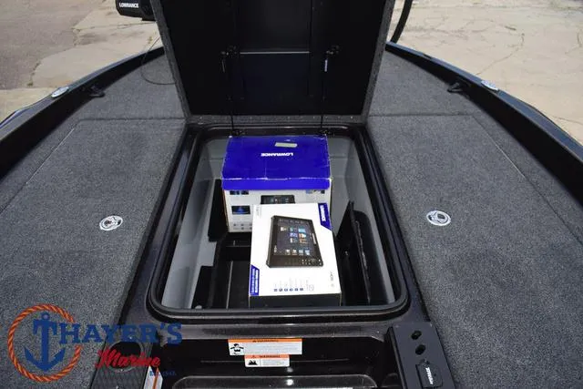 Slide: The Image of 2020 Triton 20 TRX Patriot boat storage compartment with Lowrance electronics box. - 19