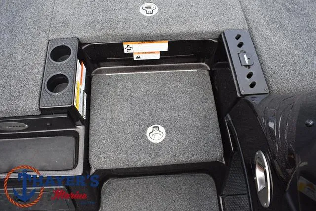 Slide: The Image of 2020 Triton 20 TRX Patriot boat deck with storage compartments and cup holders. - 20