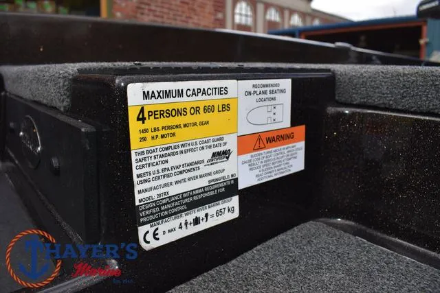 Slide: The Image of Capacity label on 2020 Triton 20 TRX Patriot boat, showing weight and passenger limits. - 22