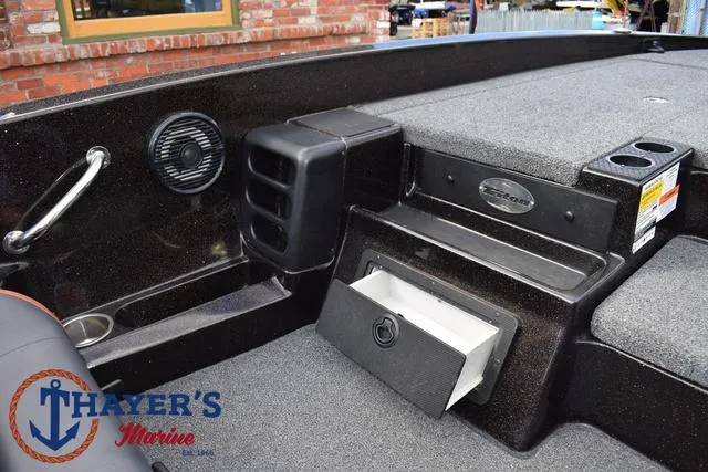 Slide: The Image of 2020 Triton 20 TRX Patriot boat interior with storage and speaker. - 26