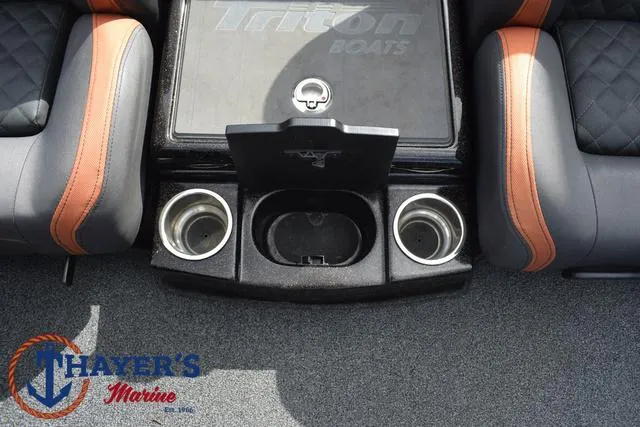 Slide: The Image of 2020 Triton 20 TRX Patriot boat interior with cup holders and storage compartment. - 29