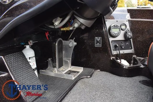 Slide: The Image of 2020 Triton 20 TRX Patriot boat interior with foot pedal and control panel. - 33