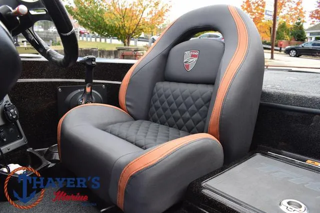 Slide: The Image of 2020 Triton 20 TRX Patriot boat seat with quilted design and orange accents. - 34
