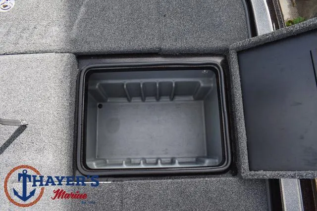 Slide: The Image of Open storage compartment on 2020 Triton 20 TRX Patriot boat deck. - 38