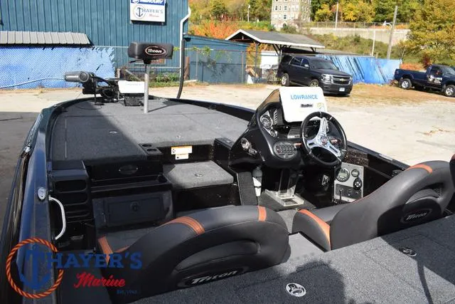 Slide: The Image of 2020 Triton 20 TRX Patriot boat interior with steering wheel and electronics. - 42