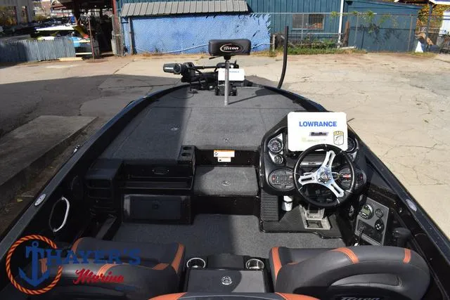 Slide: The Image of 2020 Triton 20 TRX Patriot boat interior with steering wheel and Lowrance electronics. - 43