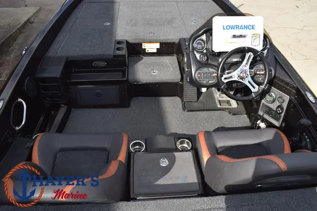 Slide: The Image of 2020 Triton 20 TRX Patriot boat interior with steering console and seating. - 45