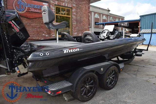 Slide: The Image of 2020 Triton 20 TRX Patriot boat on trailer, parked outside Thayer's Marine. - 49