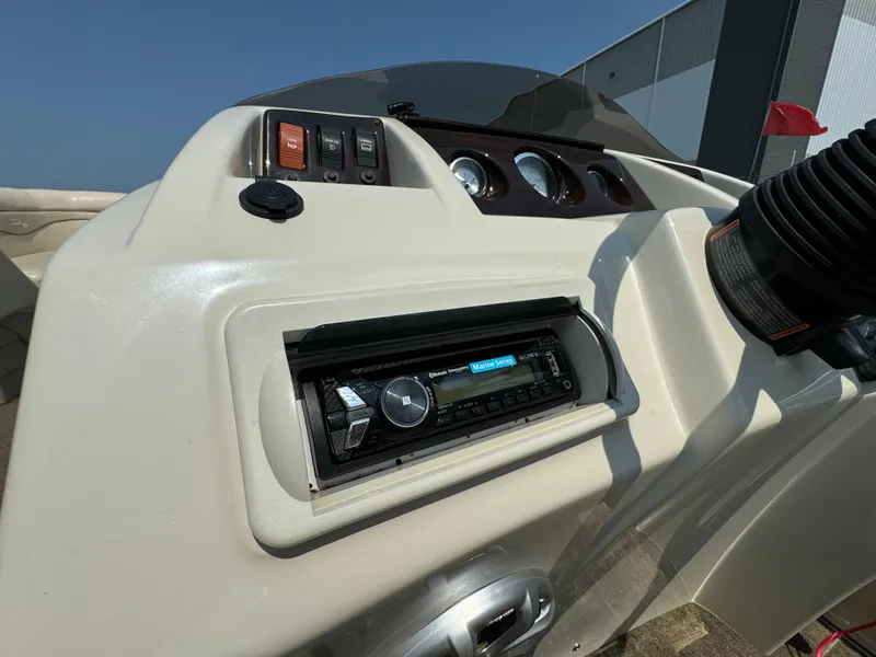 Slide: The Image of Dashboard of a 2014 Bennington 24 SLX3 boat with stereo system and controls. - 12