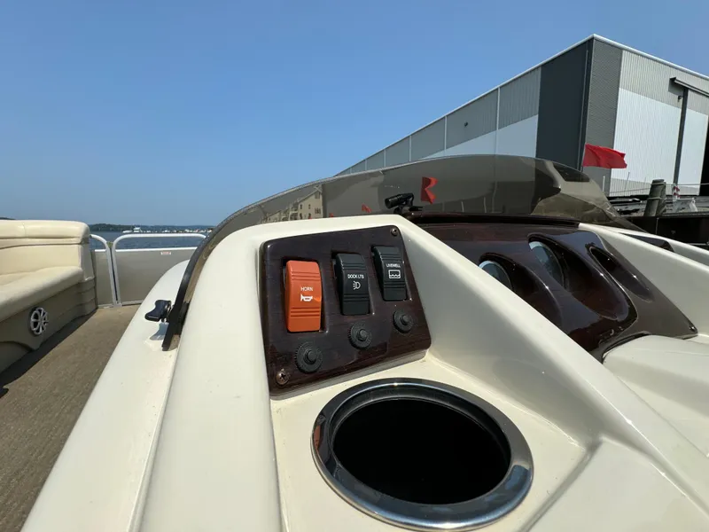 Slide: The Image of Control panel of a 2014 Bennington 24 SLX3 boat with cup holder. - 13