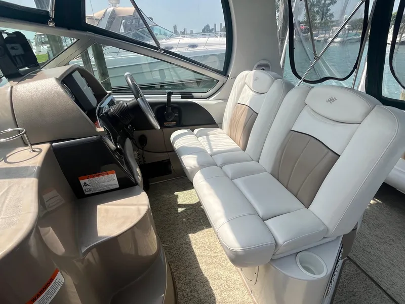 Slide: The Image of Interior of 2006 Four Winns 278 Vista boat with white and beige seating. - 7