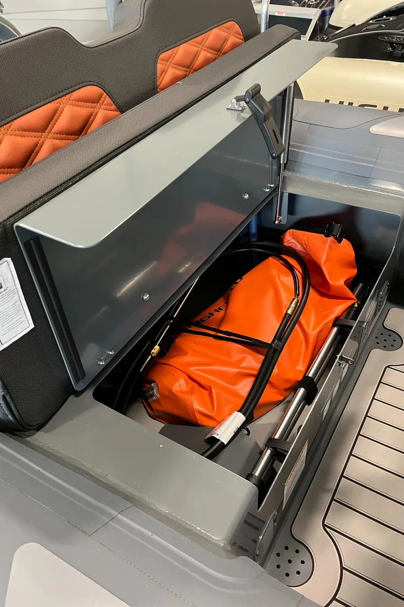 Slide: The Image of 2024 Highfield Sport 360 storage compartment with orange safety equipment. - 10