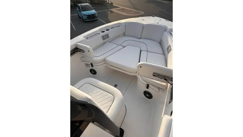 Slide: The Image of 2025 Sea Fox 248 Commander boat interior with white cushioned seating. - 10