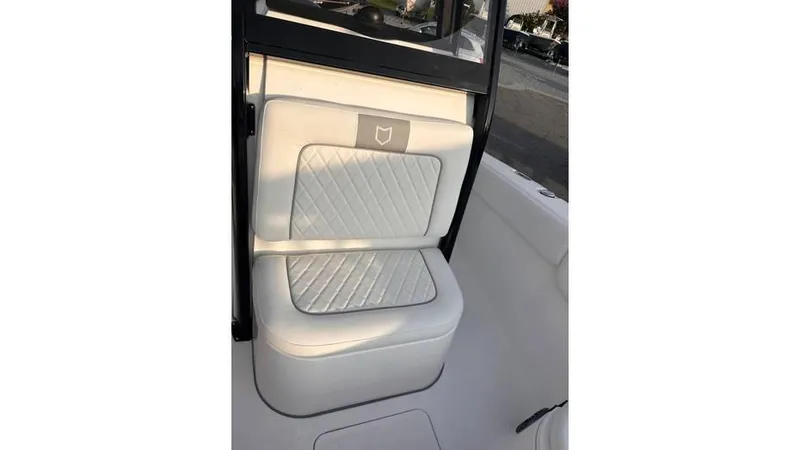 Slide: The Image of 2025 Sea Fox 248 Commander boat seat with quilted white upholstery. - 11