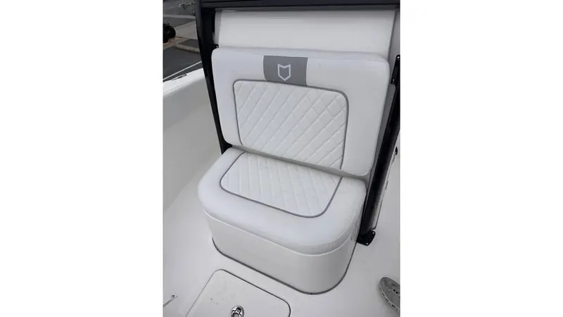 Slide: The Image of 2025 Sea Fox 248 Commander boat seat with white quilted upholstery. - 17