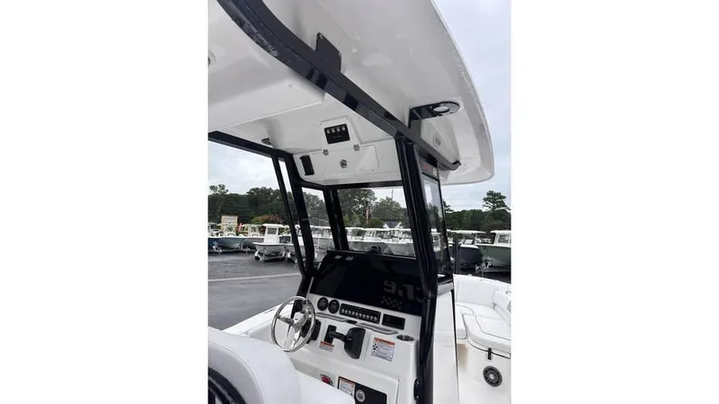 Slide: The Image of 2025 Sea Fox 248 Commander boat console with steering wheel and controls. - 21