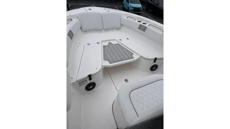 Slide: The Image of 2025 Sea Fox 248 Commander boat interior with cushioned seating and storage. - 22