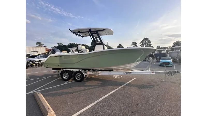 Slide: The Image of 2025 Sea Fox 248 Commander boat on trailer in parking lot, side view. - 5
