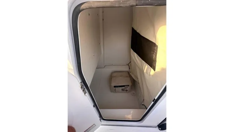 Slide: The Image of 2025 Sea Fox 248 Commander storage compartment interior view. - 8