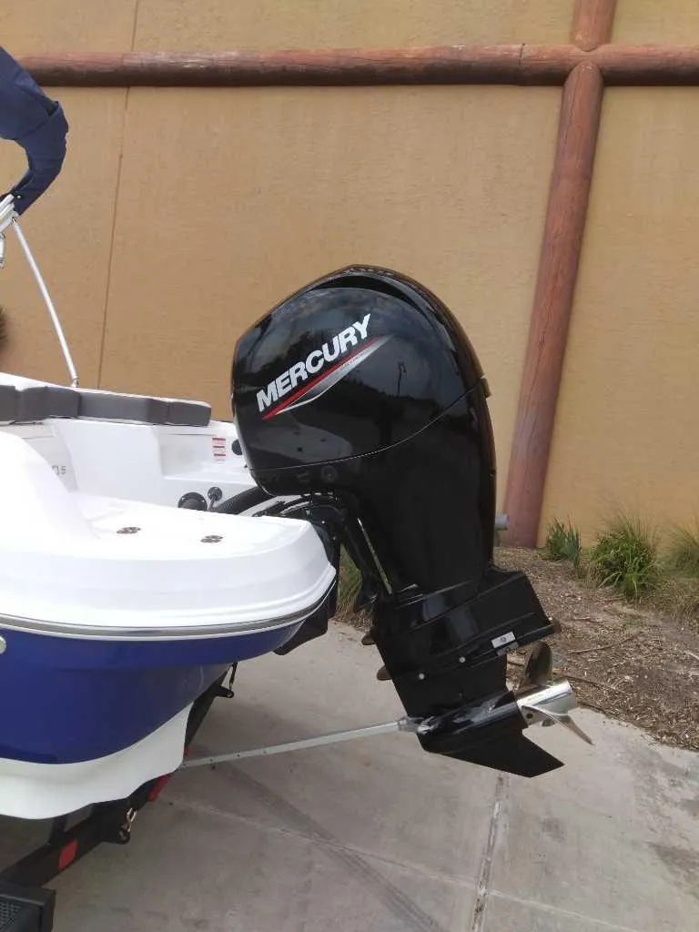 Slide: The Image of 2024 Tahoe 200 S boat with Mercury outboard motor. - 4
