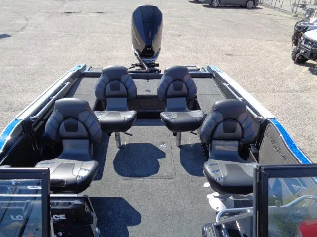 Slide: The Image of 2024 Nitro ZV20 Pro boat interior with five black seats and a motor. - 3