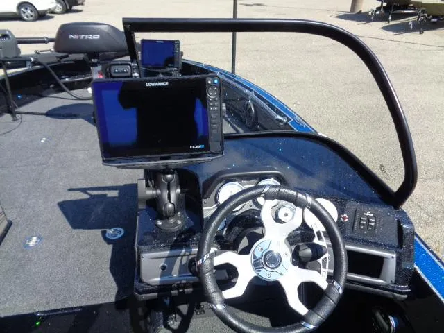 Slide: The Image of 2024 Nitro ZV20 Pro boat dashboard with steering wheel and navigation display. - 6