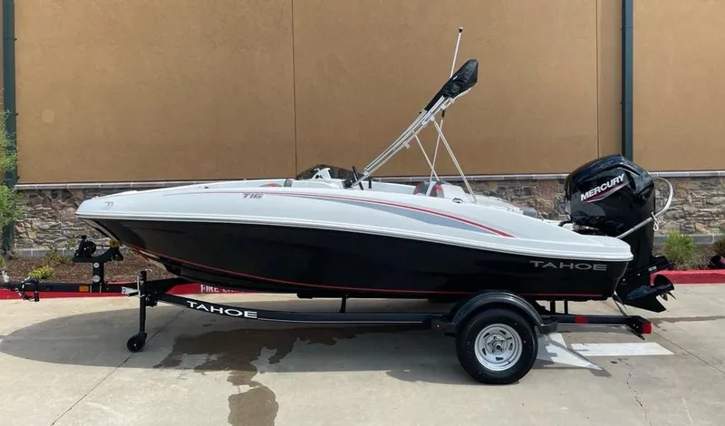 Slide: The Image of 2024 Tahoe T16 boat with Mercury engine on trailer, side view. - 0