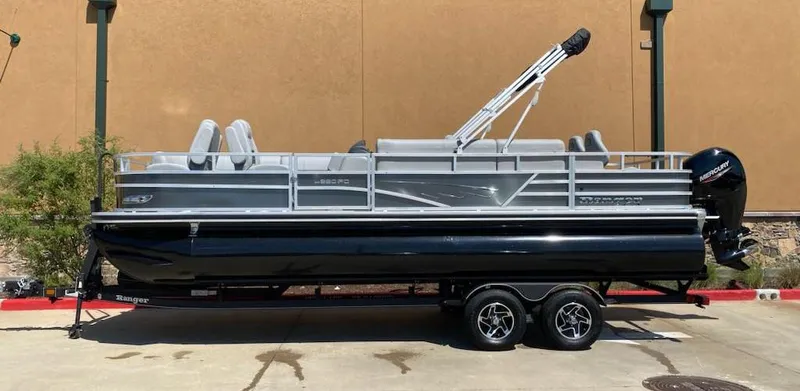 Slide: The Image of 2024 Ranger Reata 220FC pontoon boat on trailer, side view. - 0