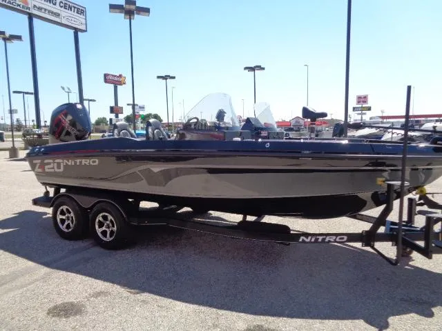 Slide: The Image of 2024 Nitro ZV20 boat on trailer in parking lot. - 2