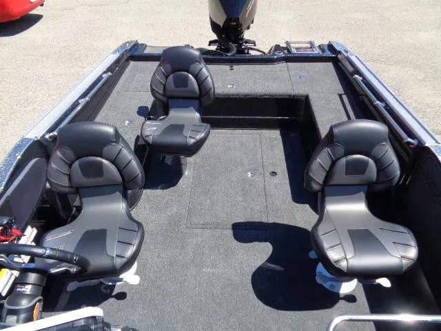 Slide: The Image of 2024 Nitro ZV20 boat interior with four black seats and spacious deck layout. - 4