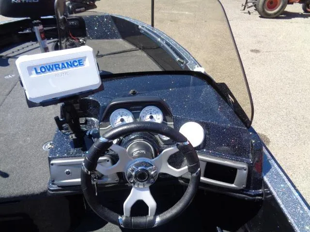 Slide: The Image of 2024 Nitro ZV20 boat dashboard with Lowrance fish finder and steering wheel. - 8