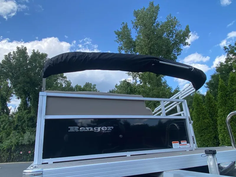 Slide: The Image of 2024 Ranger Reata 200C boat with canopy against a clear sky. - 7