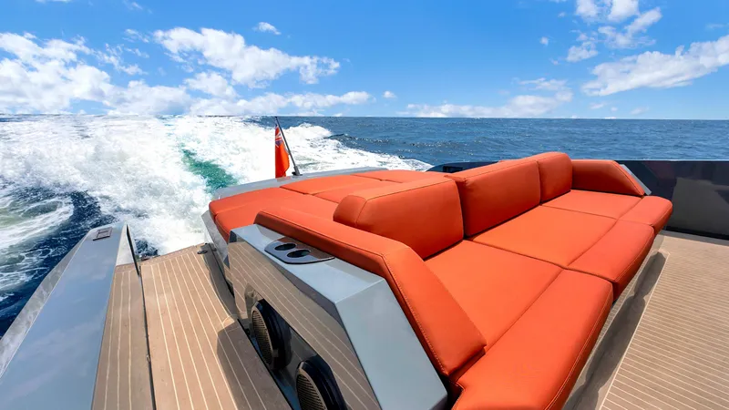 Slide: The Image of Luxurious 2017 Vanquish Yachts VQ 54 with red seating cruising on open water. - 10