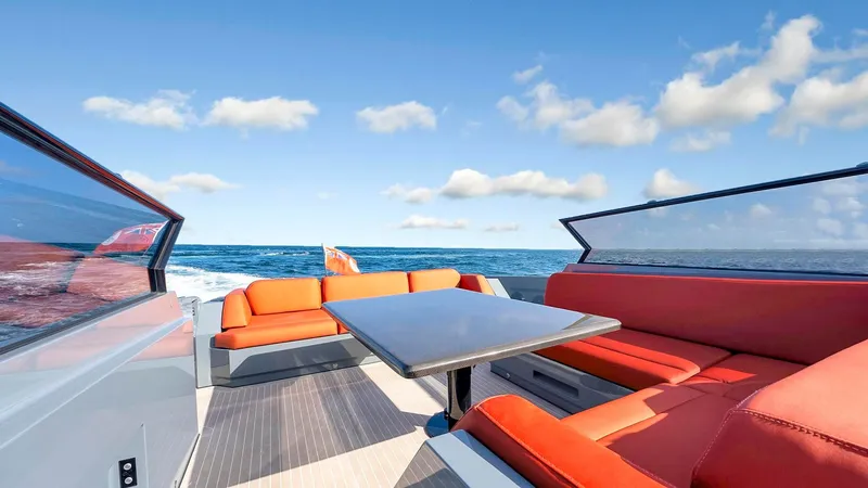 Slide: The Image of Luxurious 2017 Vanquish Yachts VQ 54 with vibrant orange seating and ocean view. - 13