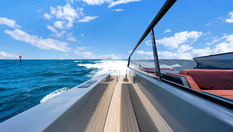 Slide: The Image of Vanquish Yachts VQ 54 cruising on open sea, 2017 model, under clear blue skies. - 18